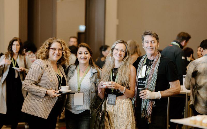 Delegates at LM23 smiling at the camera