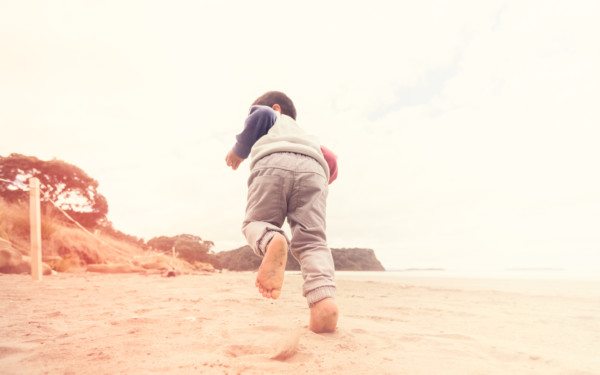 Child running on beach