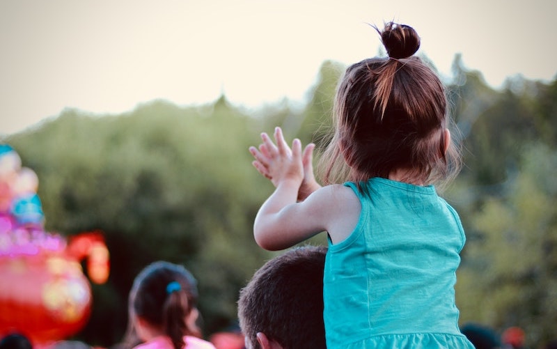 child clapping outdoors