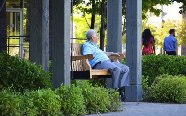 Person sitting on bench outside