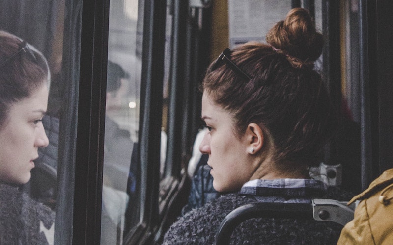 Woman sitting on public transport