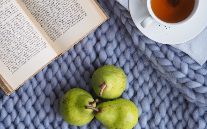 Picture of tea, a book and fruit