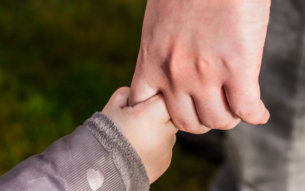 Parent and Child Hold Hands