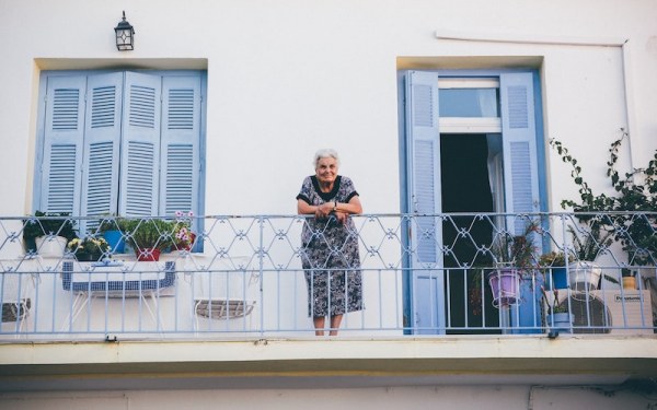 Lady on balcony in Italy