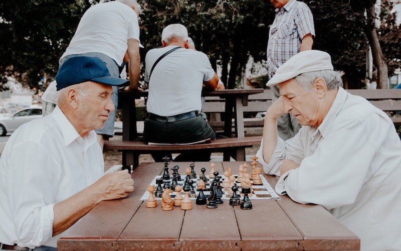 Two gentlemen playing chess